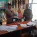 Bhabinkamtibmas dan Babinsa Kelurahan Sawah Baru Jaga Kelancaran Distribusi Bantuan Pangan